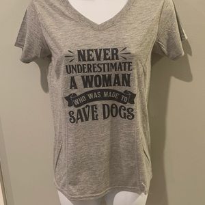 Never underestimate a woman who was made to save dogs t-shirt.